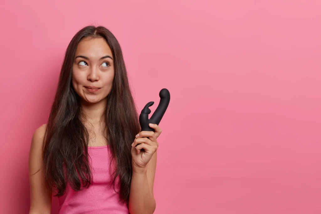 Girl holding rabbit shaped sex toy