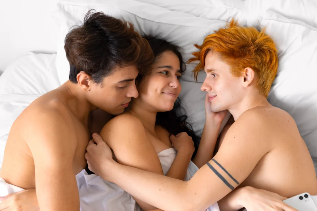 top view partners laying bed and talk about ethical non-monogamy