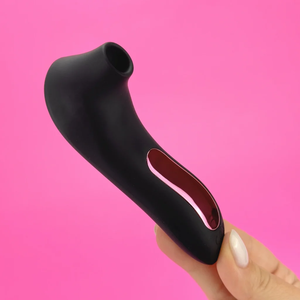 Women holding a black color Breeze clit sucker