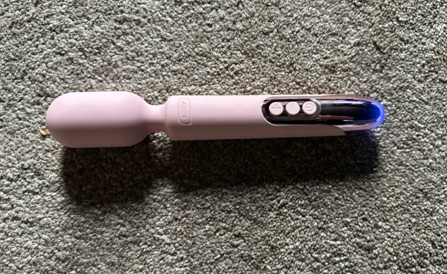 Sleek pink wand vibrator on beige background with text Best Wand Vibrator showcasing the quiet, waterproof, and app-controlled KIIROO ProWand.