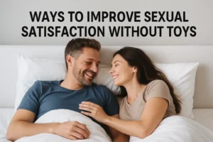 Happy couple smiling in bed while connecting emotionally and physically, representing natural ways to improve sexual satisfaction without toys