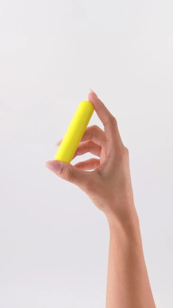 A hand hold yellow Beam mini vibrator