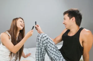 Couple enjoying intimacy with remote control vibrators for partners in bed