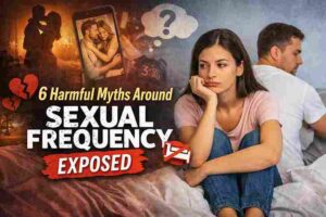 A worried couple sitting apart in bed highlighting the harmful myths around sexual frequency and how unrealistic expectations affect intimacy.