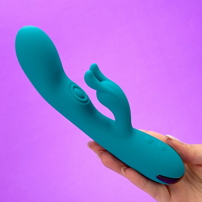 A hand holding Bunny Throb g-spot massager